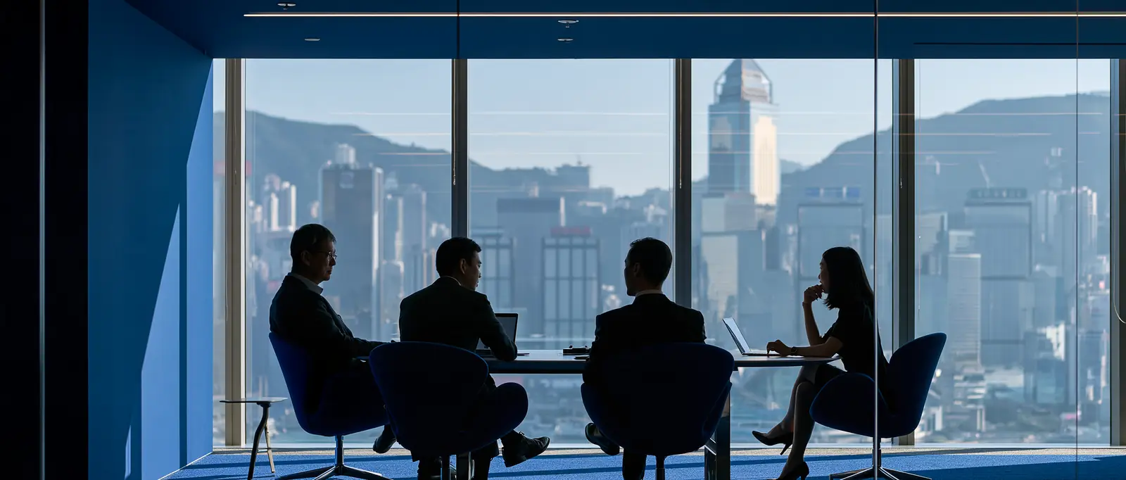 Business meeting overlooking Hong Kong harbour